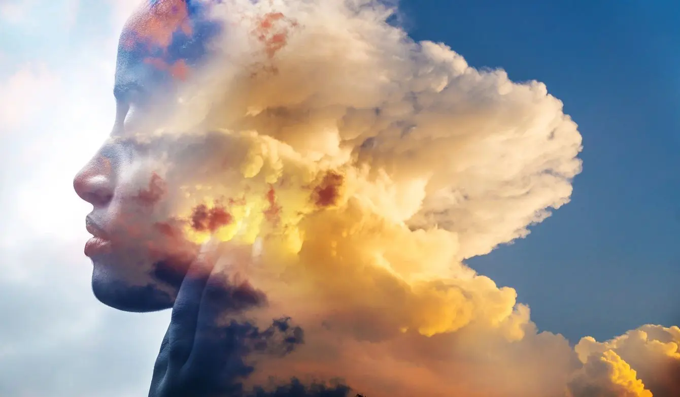 A cloud formation with the sun shining through.