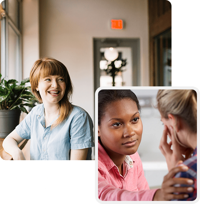 Two women sitting in a room with one woman talking on the phone.